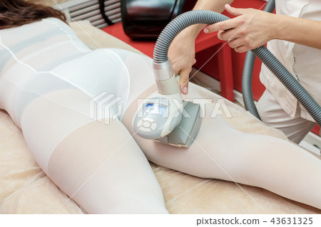 Woman having anti cellulite lpg massage Woman having anti cellulite lpg massage 43631325