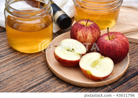 Apple cider vinegar on wooden board, Kombucha. 43631796