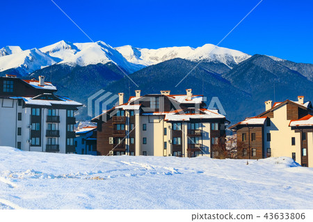 Houses and snow mountains panorama in Bansko, Bulgaria Houses and snow mountains panorama in Bansko, Bulgaria 43633806