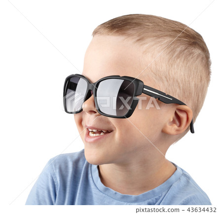 boy in sunglasses smiles at camera boy in sunglasses smiles at camera 43634432
