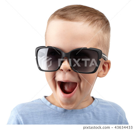 boy in sunglasses smiles at camera boy in sunglasses smiles at camera 43634433