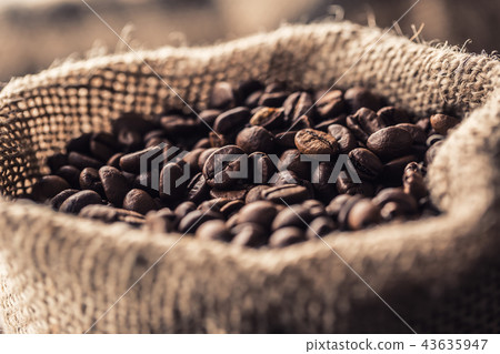 Close-up fresh roasted coffee beans in bag Close-up fresh roasted coffee beans in bag 43635947