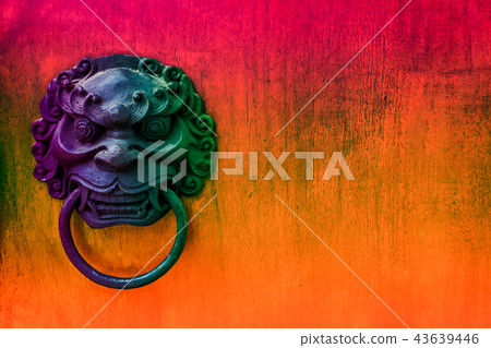 metal evil face pull gate and hard wood background 43639446
