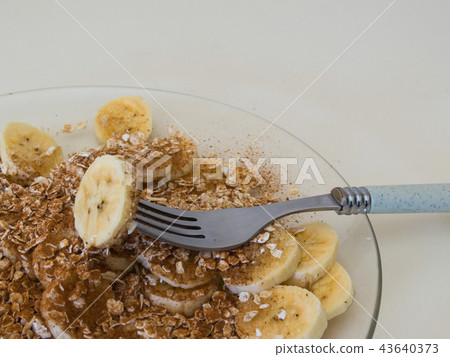 Healthy breakfast, close up of sliced bananas. 43640373