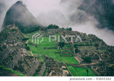 Panoramic view of Machu Picchu in mist, Peru. Panoramic view of Machu Picchu in mist, Peru. 43643162
