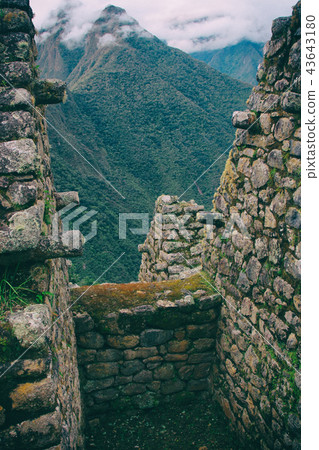 Vertical view of wild Andes from ancient ruins. Vertical view of wild Andes from ancient ruins. 43643180