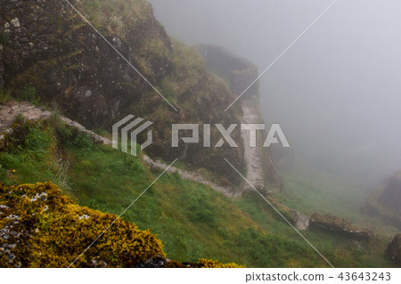 Inca Trail ruins and fog. Inca Trail ruins and fog. 43643243