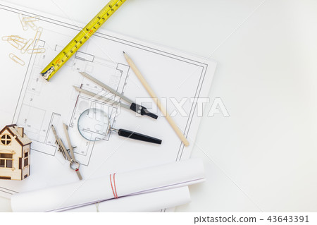 Interior designer table workplace with house plan 43643391