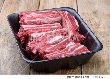 Fresh beef meat in a black tray Fresh beef meat in a black tray 43643729