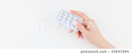 Female hand with pills in blister 43643904