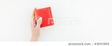 Woman hand with red wallet isolated Woman hand with red wallet isolated 43643905