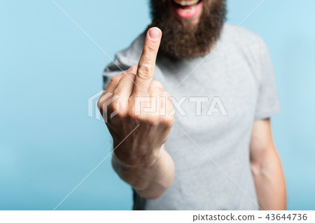 bearded man middle finger rude provocation defiance bearded man middle finger rude provocation defiance 43644736