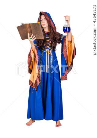 Beautiful young halloween witch girl casting magic Beautiful young halloween witch girl casting magic 43645173