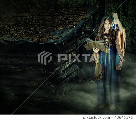 Beautiful young halloween witch girl casting magic Beautiful young halloween witch girl casting magic 43645176