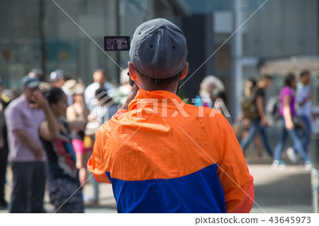 Professional video operator working outdoors Professional video operator working outdoors 43645973