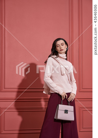 Model posing in studio in trendy clothes Model posing in studio in trendy clothes 43646986