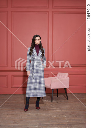 Model posing in studio in trendy clothes Model posing in studio in trendy clothes 43647040