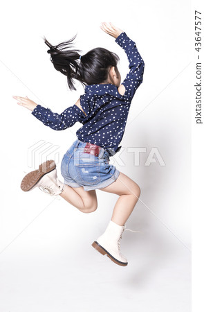 Portrait of happy little Asian child jumping 43647577