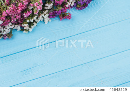 Little limonium flowers on wooden table. Little limonium flowers on wooden table. 43648229