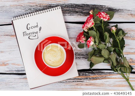 Morning coffee and flowers. 43649145