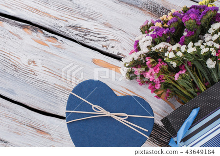 Blue heart box and flowers. Blue heart box and flowers. 43649184