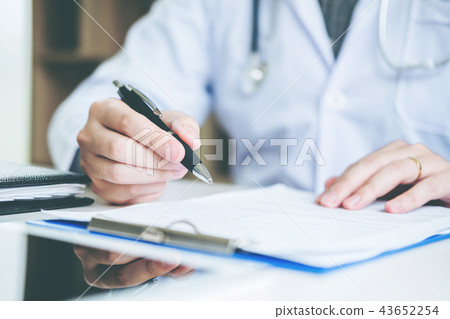 Doctor typing information working in Hospital  43652254