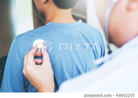 Doctor listening to patients breathing sound Doctor listening to patients breathing sound 43652255