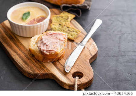 Fresh homemade chicken pate with bread on a black background. Copy space. Fresh homemade chicken pate with bread on a black background. Copy space. 43654166