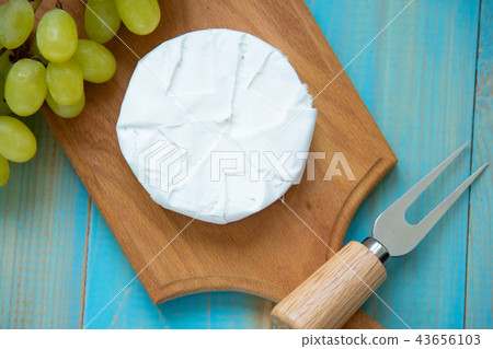 camembert, with a fork for cheese and grape 43656103