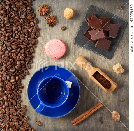 cup of coffee and beans on wooden background cup of coffee and beans on wooden background 43659326