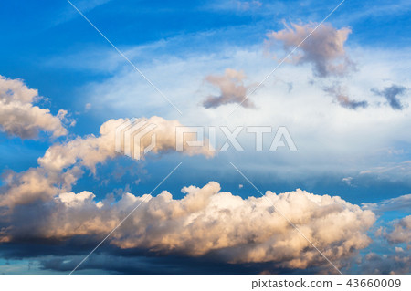 cumuli clouds in dark blue sky in summer evening cumuli clouds in dark blue sky in summer evening 43660009