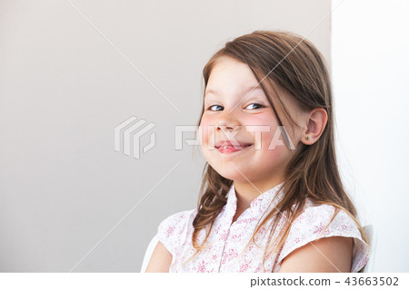 Smiling funny blond Caucasian little girl Smiling funny blond Caucasian little girl 43663502