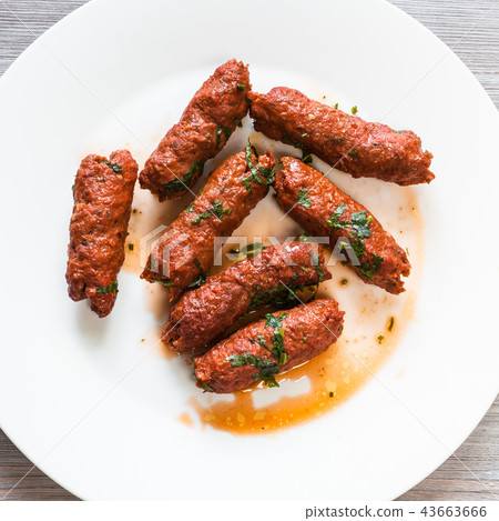 Mutton Seekh Kabab on white plate close up Mutton Seekh Kabab on white plate close up 43663666