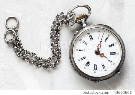 retro pocket watch with chain on white plaster retro pocket watch with chain on white plaster 43663668