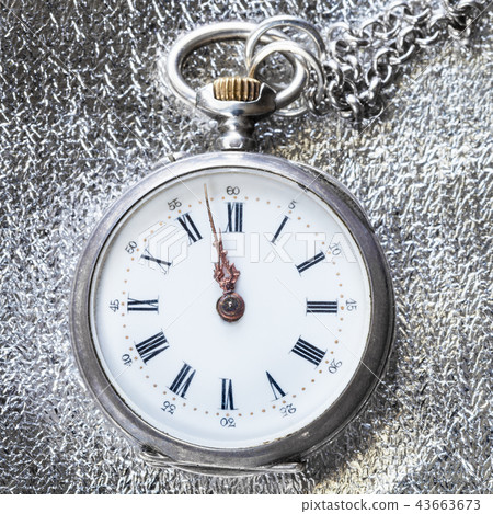 antique pocket watch on silver cloth close up antique pocket watch on silver cloth close up 43663673