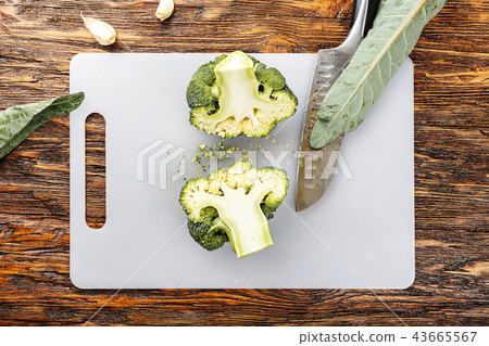 fresh broccoli on a cutting table. top view fresh broccoli on a cutting table. top view 43665567