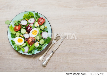 Fresh salad with vegetables for proper nutrition. Fresh salad with vegetables for proper nutrition. 43665795