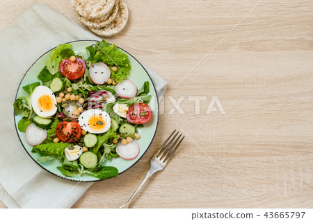 Fresh salad with vegetables for proper nutrition. Fresh salad with vegetables for proper nutrition. 43665797