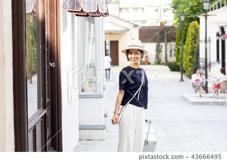 A young woman traveling alone A young woman traveling alone 43666495