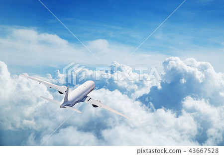 Commercial airplane flying above clouds 43667528