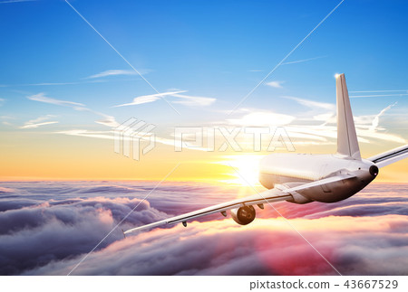 Commercial airplane flying above clouds Commercial airplane flying above clouds 43667529