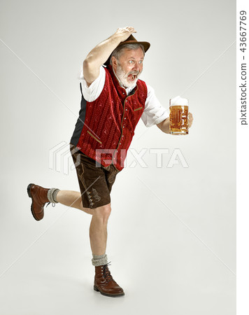 Portrait of Oktoberfest man, wearing a traditional Bavarian clothes Portrait of Oktoberfest man, wearing a traditional Bavarian clothes 43667769