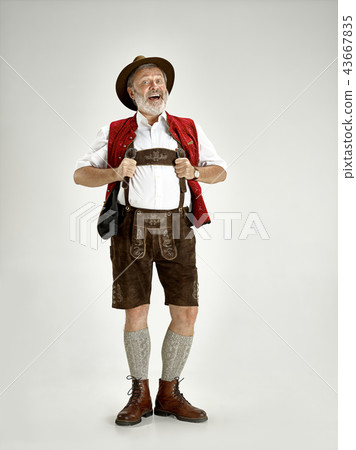 Portrait of Oktoberfest man, wearing a traditional Bavarian clothes Portrait of Oktoberfest man, wearing a traditional Bavarian clothes 43667835