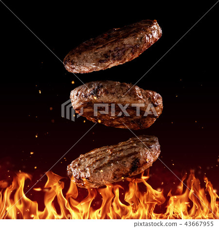 Flying beef minced hamburger pieces on black 43667955