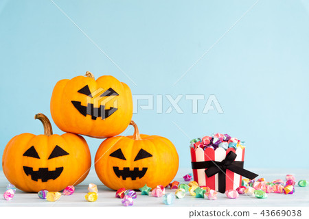 Yellow ghost pumpkin with paper star in cup Yellow ghost pumpkin with paper star in cup 43669038