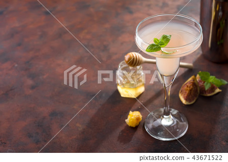 The rose exotic cocktail and figs, honey on brown 43671522
