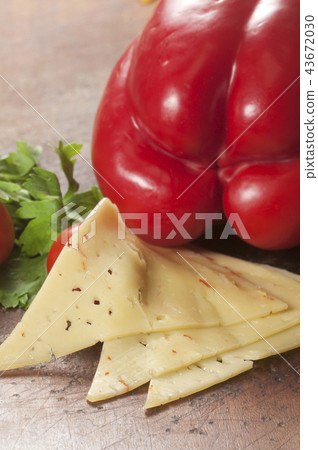 Cheese on a timber board 43672030