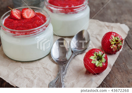 Yogurt with jam sauce in glass and a bucket of fre Yogurt with jam sauce in glass and a bucket of fre 43672268