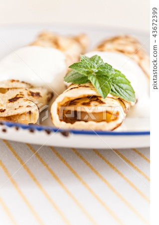 thin crepes rolled pancakes with sour cream mint 43672399