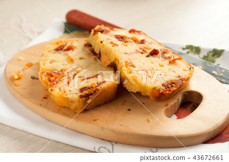 slices of cheese bread with dried tomatoes on a cu slices of cheese bread with dried tomatoes on a cu 43672661